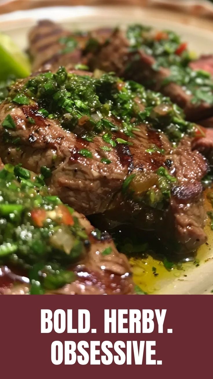 A perfectly grilled steak generously topped with vibrant chimichurri sauce.