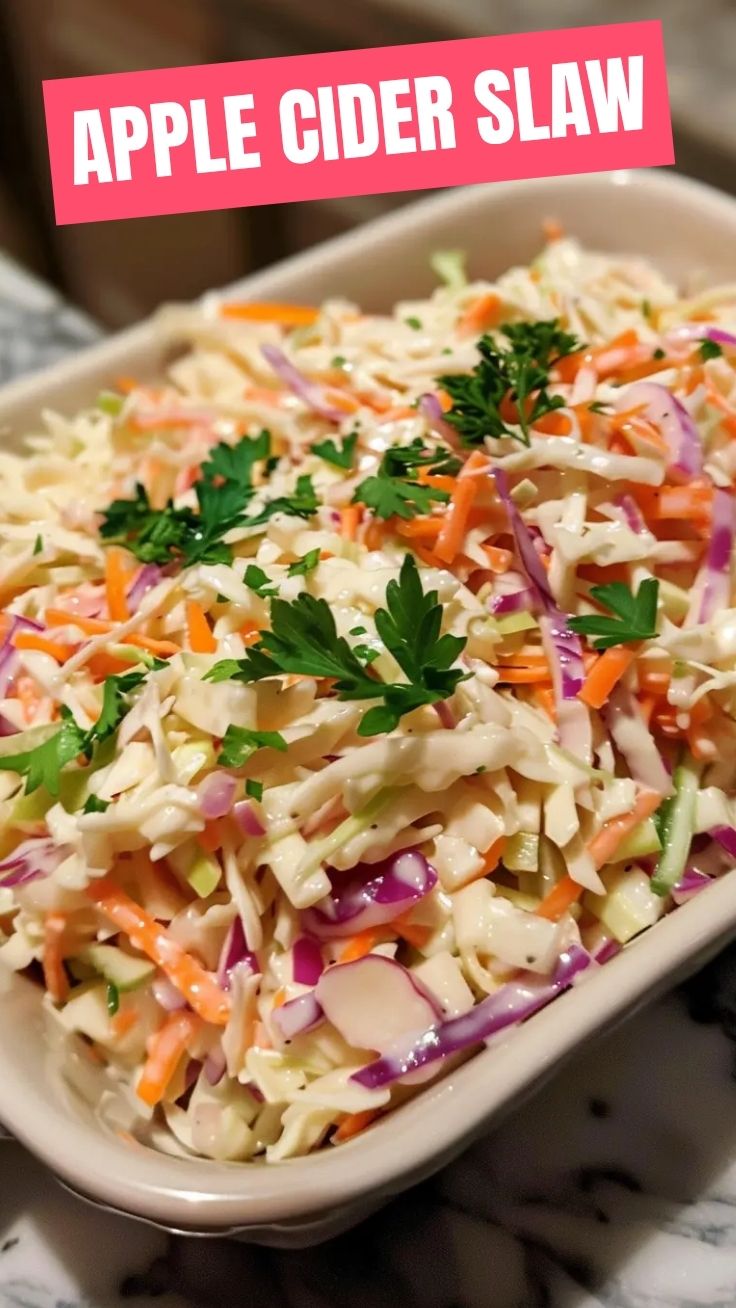 A close-up of fresh creamy coleslaw in a serving bowl.