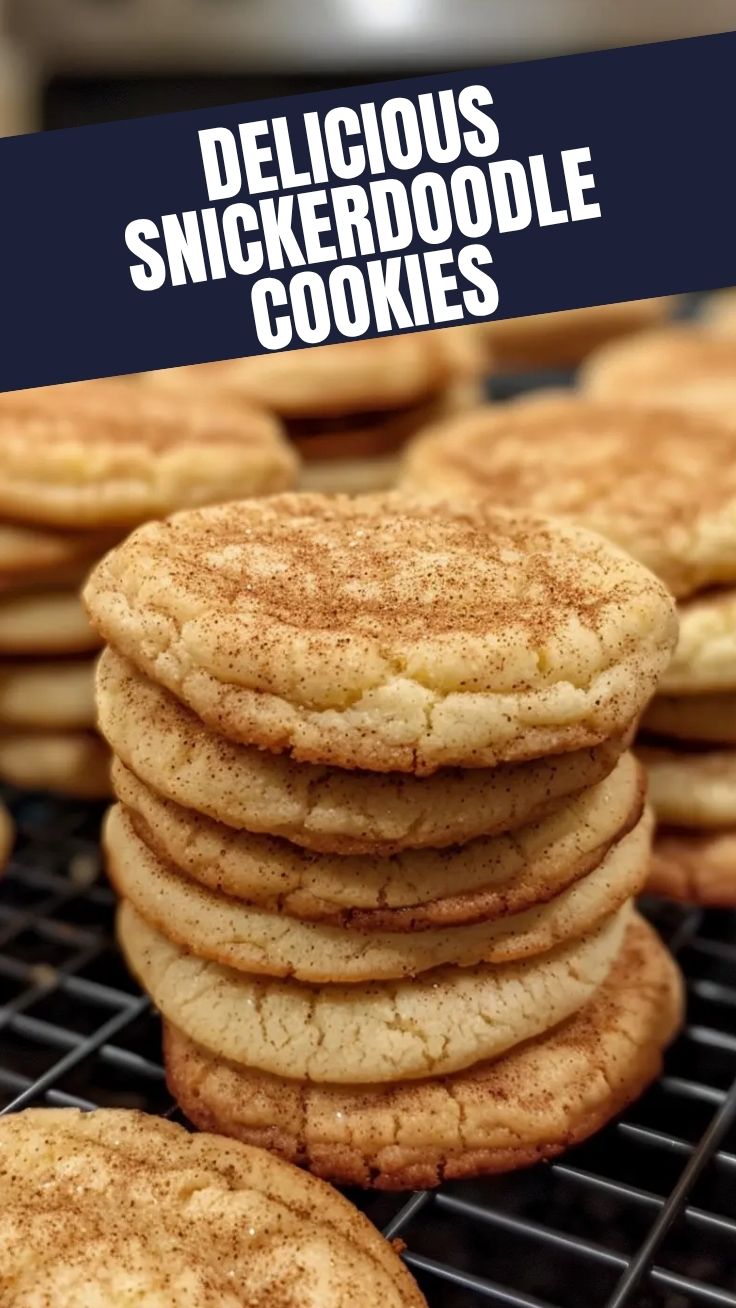 A plate of freshly baked snickerdoodle cookies, warm and crinkled with cinnamon sugar.